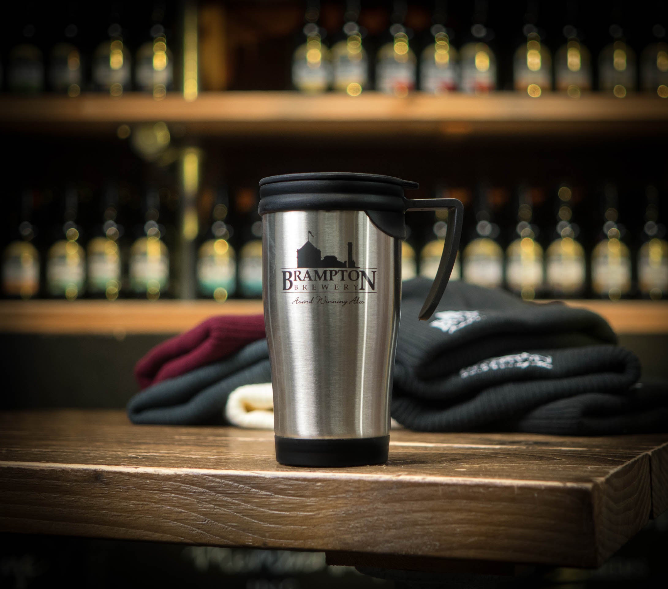 Stainless steel travel mug with &