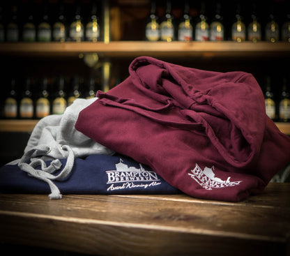 Folded maroon and navy hoodies with &