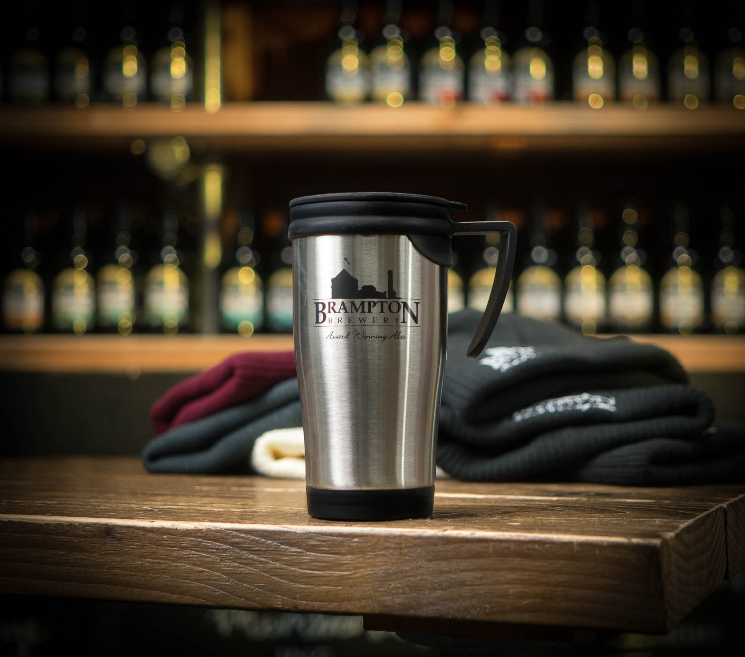 Stainless steel travel mug with &